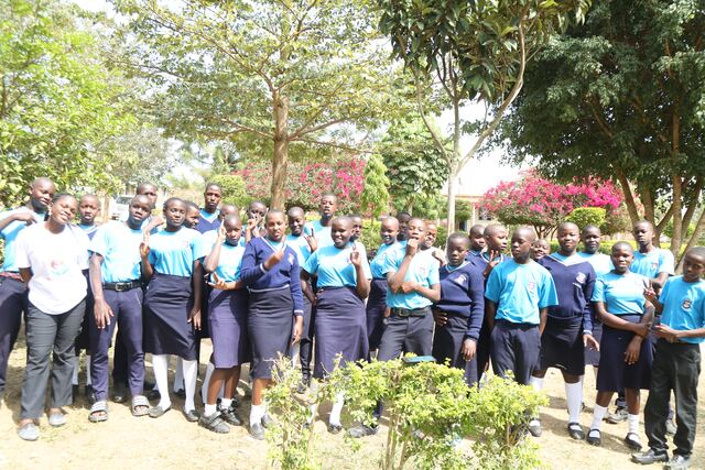 Students and foundation team members gathered together outdoors