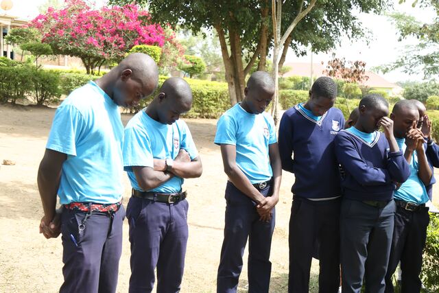 Students taking part in a reflective moment outdoors